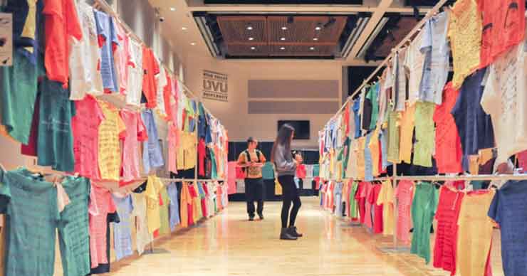 Visitors walking through the clothesline display